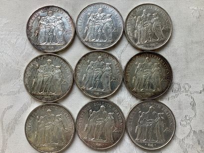 9 silver 10 franc Hercules coins.