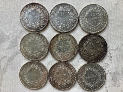 9 silver 10 franc Hercules coins.
