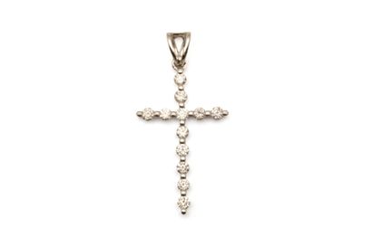 Petit pendentif retenant une croix en or...