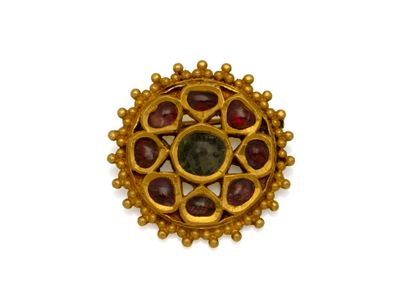 Broche ronde en or 750 millièmes, à décor...