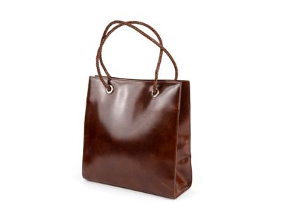 CARTIER
Lady's brown leather bag, braided...