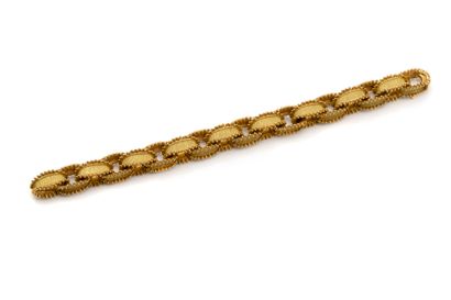 HERMÈS
Bracelet articulé en or 750 millièmes...