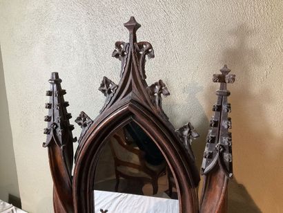A neo-Gothic style oak psyche. One drawer....