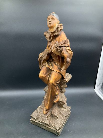 Statuette of Pierrot playing the guitar....