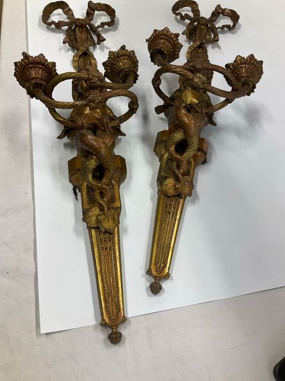 Pair of bronze sconces decorated with a mermaid...