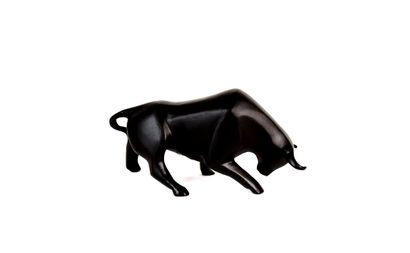 Black patina animal bronze featuring a bull...