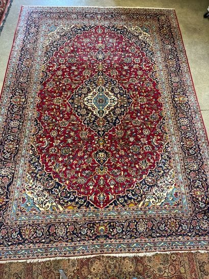An Oriental rug, size approx. 4.30 m x 3...