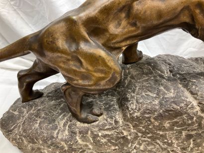 Bronze sculpture of a roaring lion on a granite...