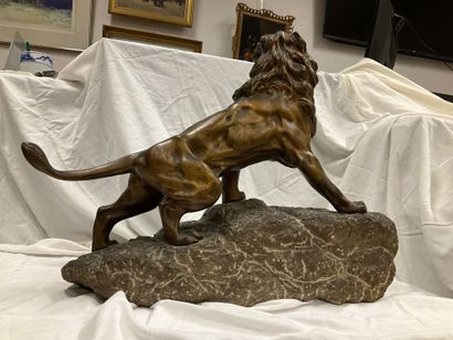 Bronze sculpture of a roaring lion on a granite...
