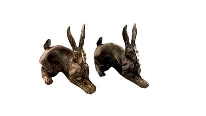 Pair of animal bronzes featuring two recumbent...