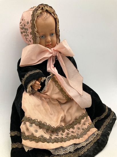 2 dolls in traditional Breton costumes. One,...