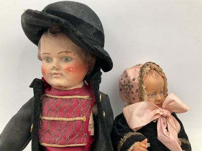 2 dolls in traditional Breton costumes. One,...