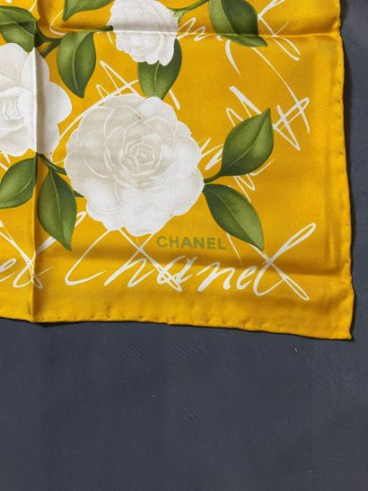 Yellow Chanel scarf with white flower design....