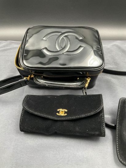 CHANEL. Black vinyl vanity case number 5100665....