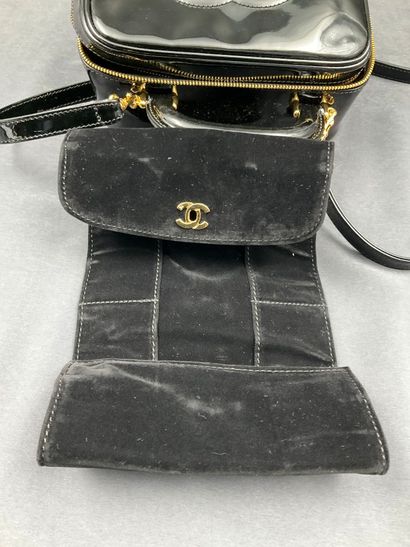 CHANEL. Black vinyl vanity case number 5100665....