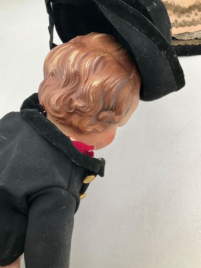 2 dolls in traditional Breton costumes. One,...