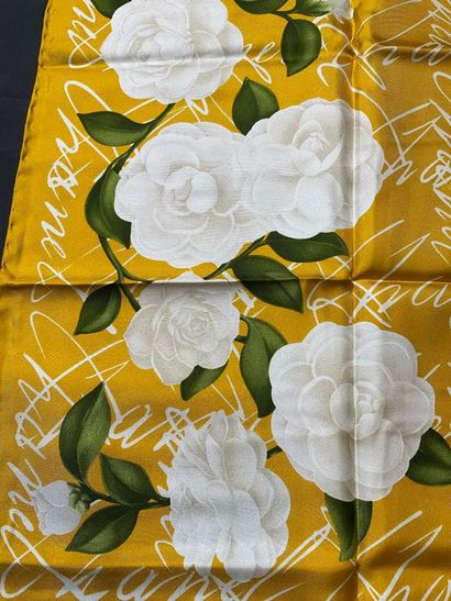 Yellow Chanel scarf with white flower design....