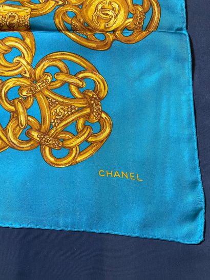 Blue Chanel scarf with gold chain decoration.
Very...