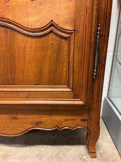 A walnut armoire. Louis XV/Louis XVI style....