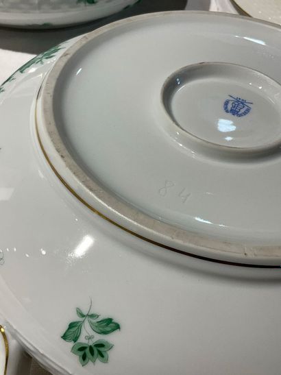 A porcelain service with floral decoration....