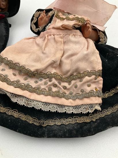 2 dolls in traditional Breton costumes. One,...