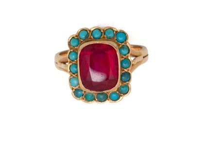 750 thousandths gold ring set with a red...