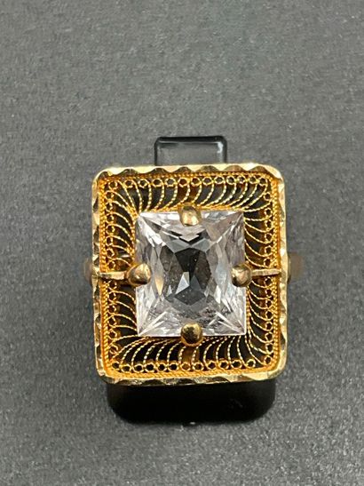 750 thousandths gold ring set with a white...