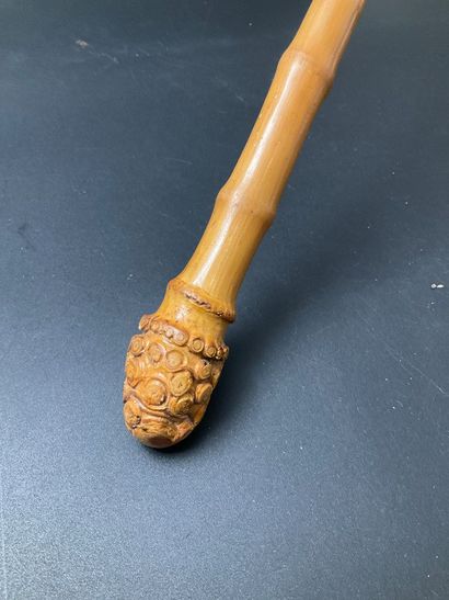 A cotton parasol on a bamboo stem base. A...