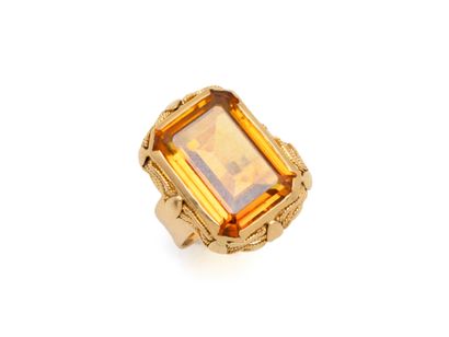 750 thousandths gold ring set with a close-set...