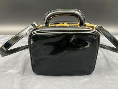 CHANEL. Black vinyl vanity case number 5100665....