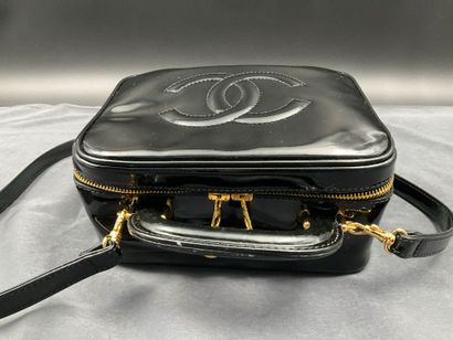 CHANEL. Black vinyl vanity case number 5100665....