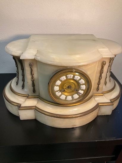A late 19th century mantel clock. White marble...