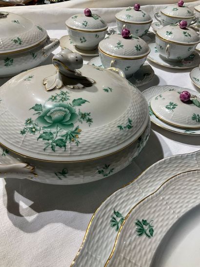 A porcelain service with floral decoration....