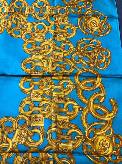 Blue Chanel scarf with gold chain decoration.
Very...
