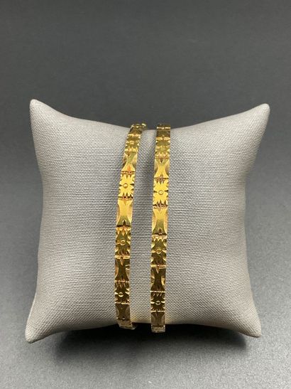 Two 750 thousandths yellow gold bracelets....