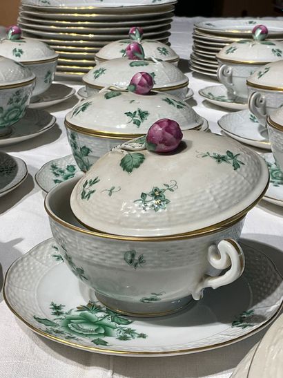A porcelain service with floral decoration....