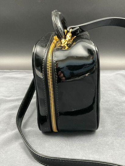 CHANEL. Black vinyl vanity case number 5100665....