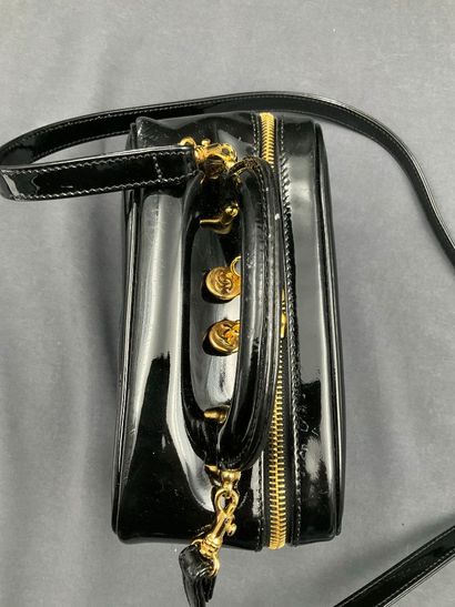 CHANEL. Black vinyl vanity case number 5100665....