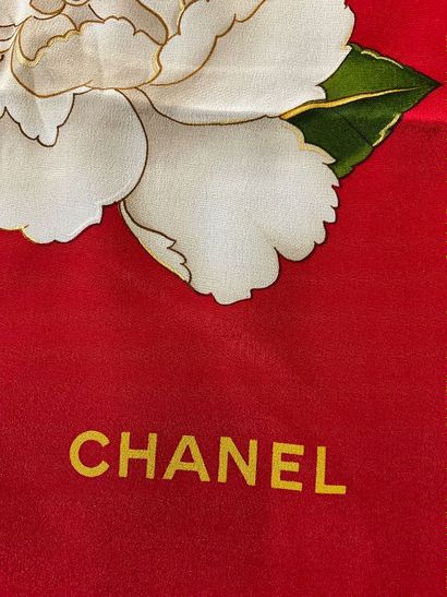Red Chanel scarf with white camellia decoration...