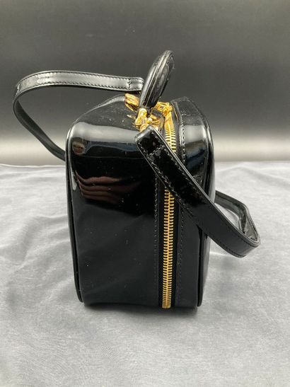 CHANEL. Black vinyl vanity case number 5100665....