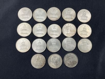 18 pièces de 100 francs en argent. Poids...