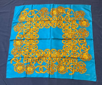Blue Chanel scarf with gold chain decoration.
Very...