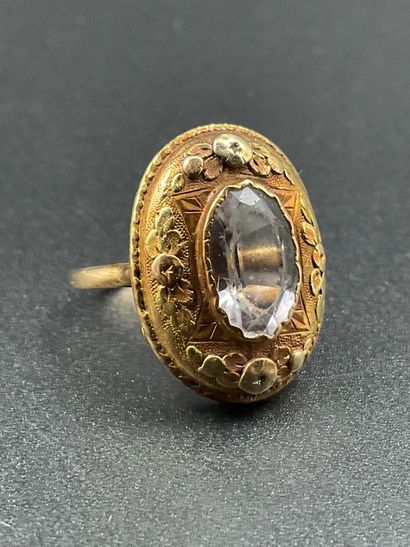750 thousandths gold ring set with a white...