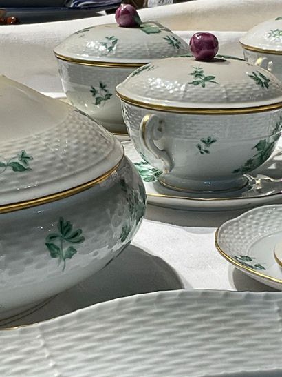 A porcelain service with floral decoration....