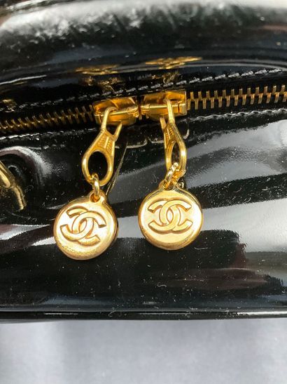 CHANEL. Black vinyl vanity case number 5100665....