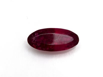 Oval faceted rubellite tourmaline on paper...