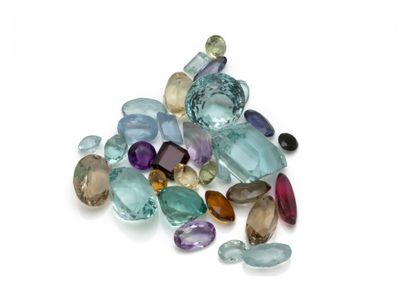 Set of stones on paper, composed of gemstones...