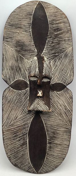 Art d’Afrique, bouclier ou masque en bois...