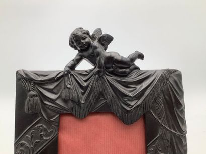 Cadre en ébène à décors d’angelot
29x19c...