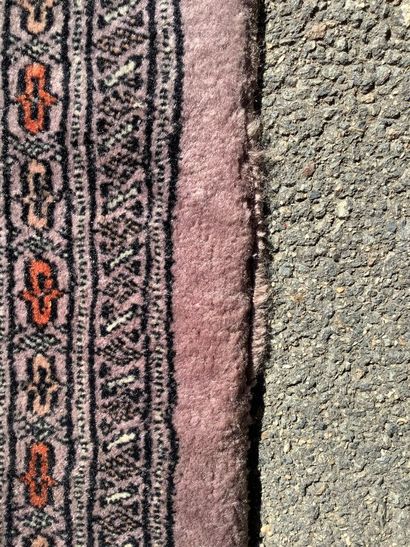 Large, handmade Bukhara-style rug in shades...